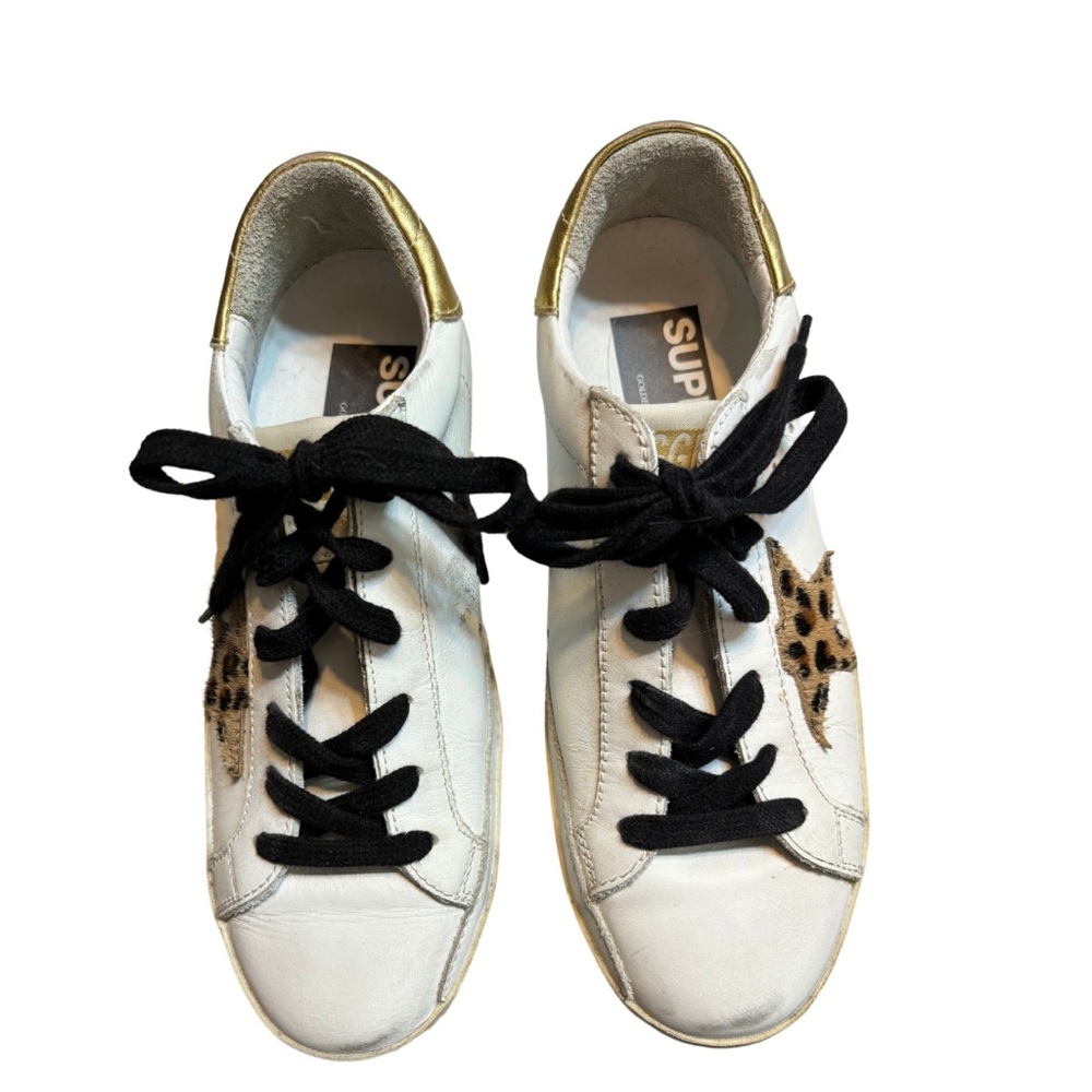 Golden Goose Sneakers with gold backs, animal print star, black laces